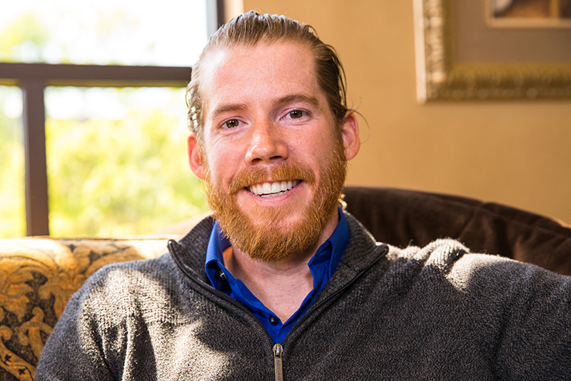 a patient smiling after his dental implants procedure